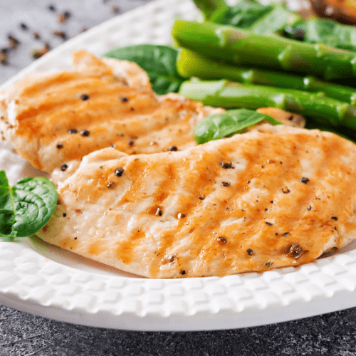 Basil Chicken Over Fresh Greens and Asparagus